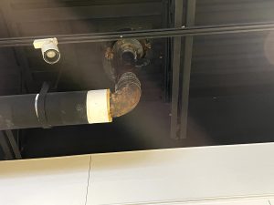 Leaking water has caused surrounding pipes and infrastructure to rust prematurely, as seen here in the high school art wing.