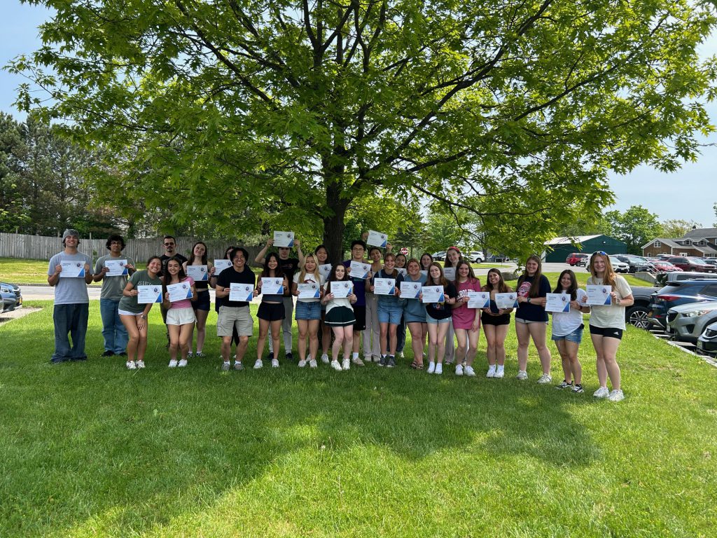 AP French students celebrate their prizes.