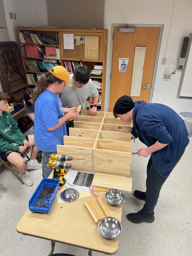 FMHS technology students work together to build equipment for Friends Forever Animal Rescue.