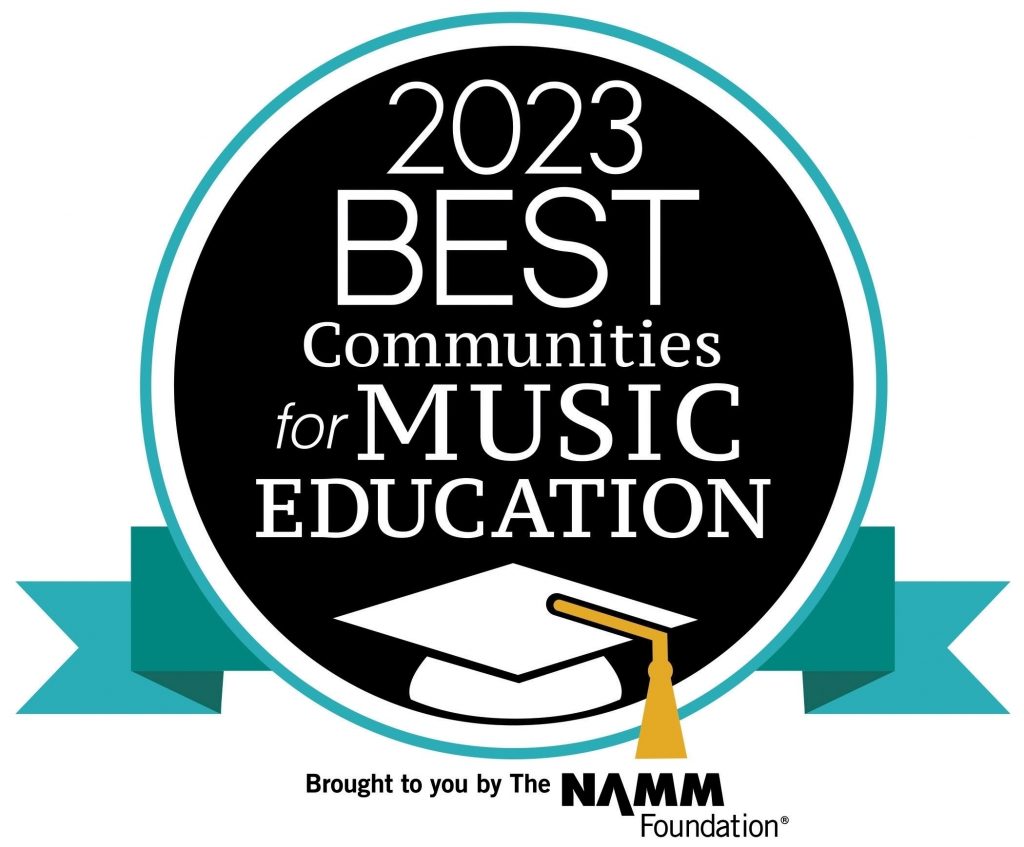 2023 Best Communities for Music Education award, a circle indicating so with a graduation cap on the bottom.