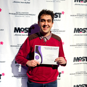 FMHS student Deniz Gursoy holds up a certificate at the CNY Science and Engineering Fair.