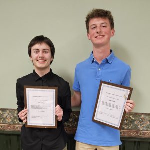Hiro Havey and Andrew Hoehner standing side-by-side holding certificates