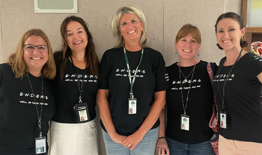 Five teachers wear tshirts that say "Enders... we'll be there for you".