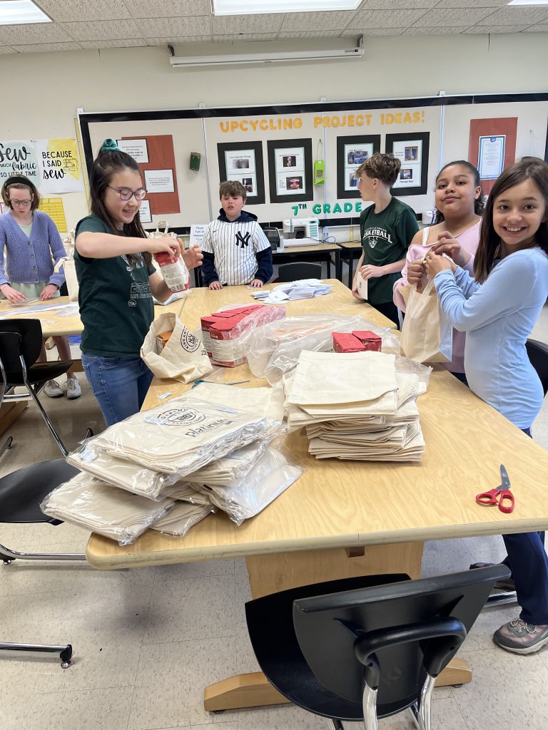 Eagle Hill students pack up bread making kits.