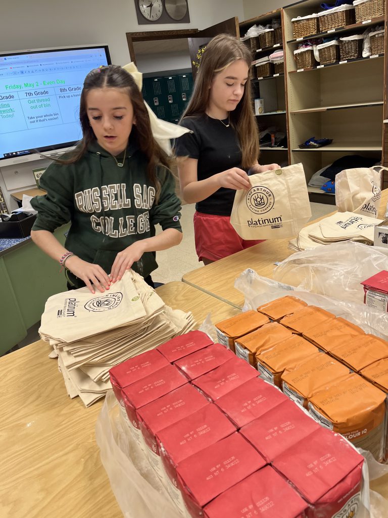 Eagle Hill students pack up bread making kits.