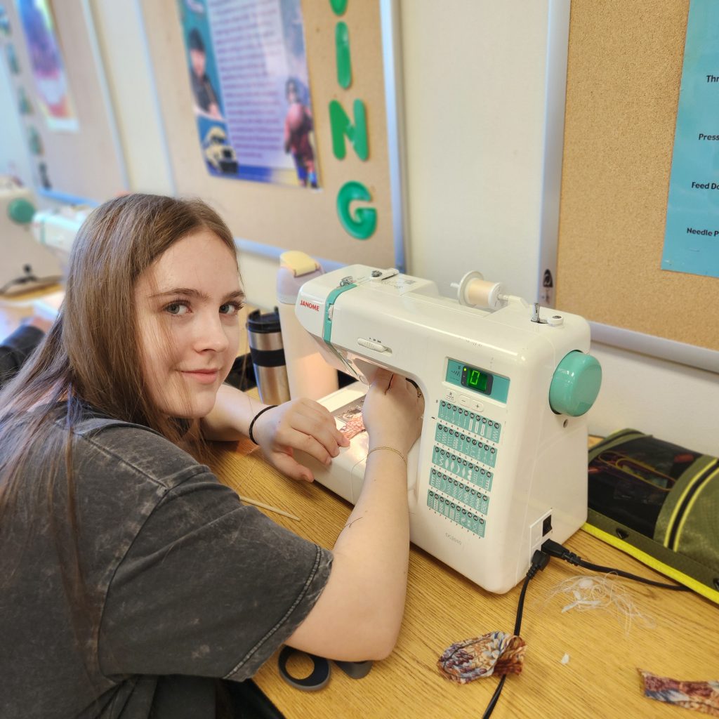 A student sews.