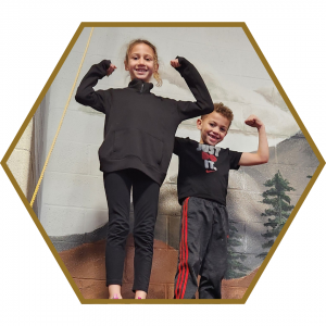 students flexing their muscles to show that they are strong