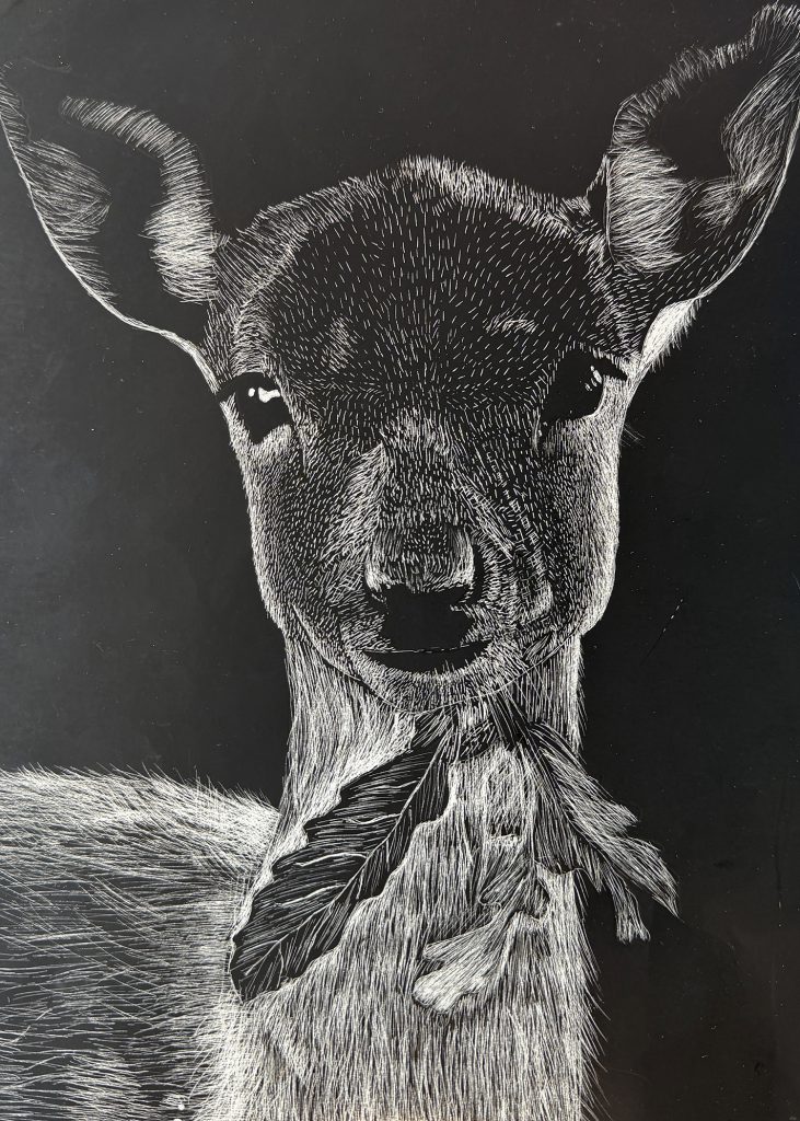 Student drawing of a the face of a deer chewing a leaf