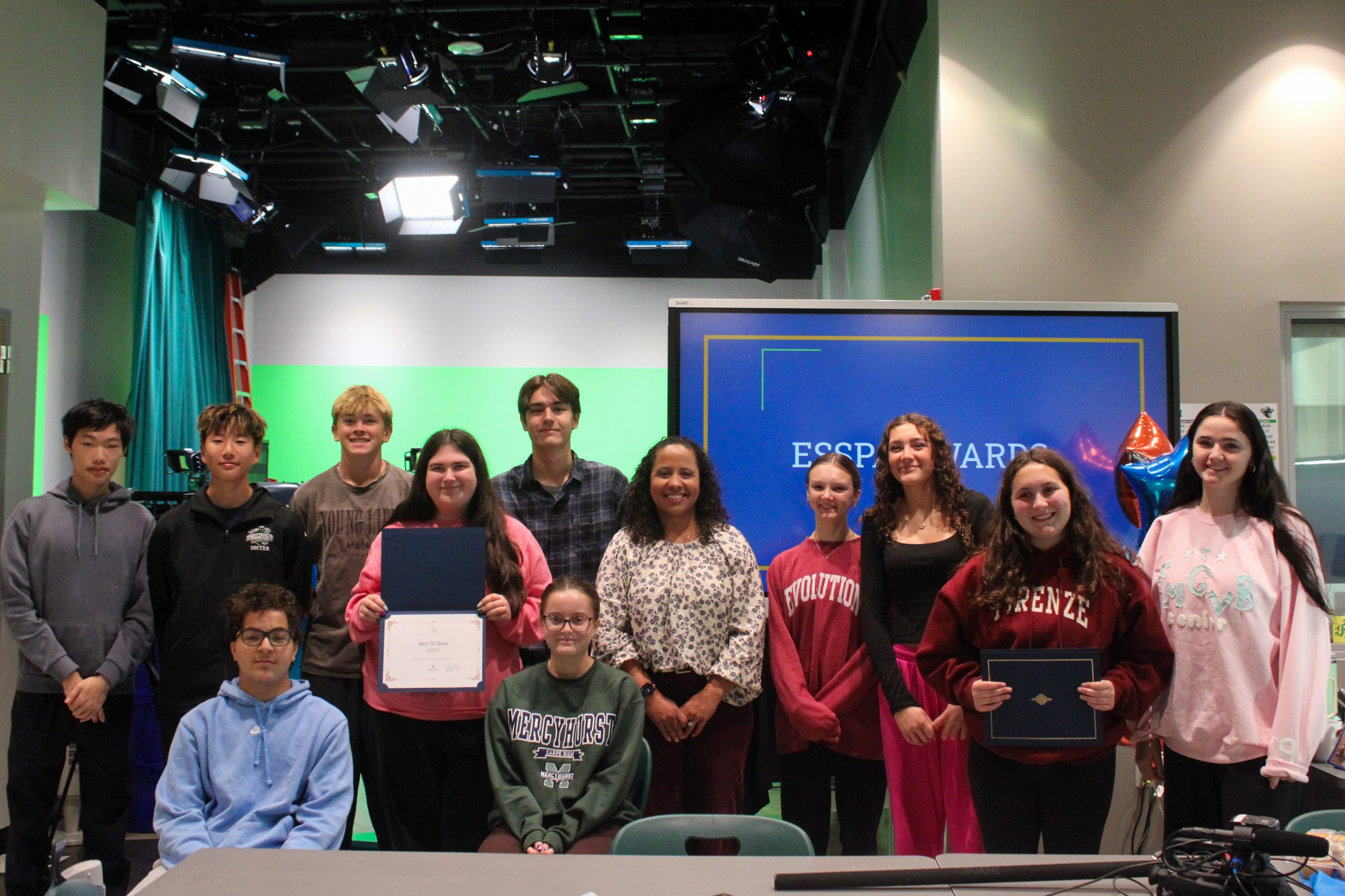 STUDENTS POSE WITH THEIR AWARD